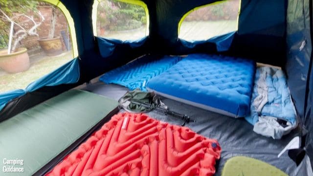This is a picture of my Coleman 10-Person Instant Cabin Tent with 10 sleeping pads (a mix of 2 single and 4 double sleeping pads) inside the tent.