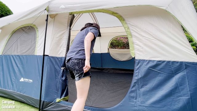 This is a picture of me ducking to get through the door into the Ozark Trail 10-Person Family Cabin Tent.
