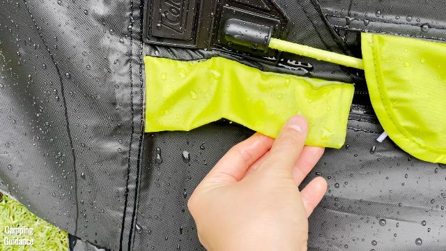 I found that this yellow rain cover of the Coleman 10-Person Instant Cabin Tent (which was supposed to protect the zipper from rain) was completely soaked with water.