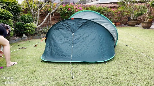 This is a picture of me guying out the 3 guy-out points at the back of the Quechua 2 Seconds Pop Up Tent.