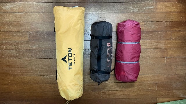 This is what a Teton Sports 1-Person Vista Quick Tent (pop up tent, left), looks like beside an Alps Mountaineering Lynx 1 Tent (middle) and an MSR Hubba Hubba NX 1-Person Tent (right).