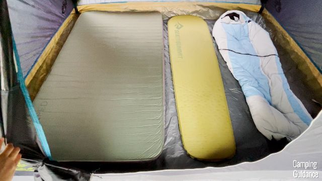 This is what 4 pads look like inside the Coleman Carlsbad 4-Person Dome Tent. From left to right: Exped MegaMat Duo 10, Sea to Summit Camp Mat, Big Agnes Friar sleeping bag.