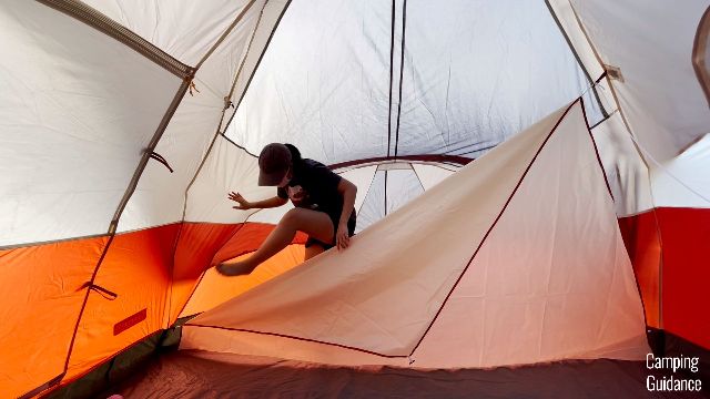 This is a picture of me climbing over the divider of the Coleman Red Canyon 8-Person Tent.