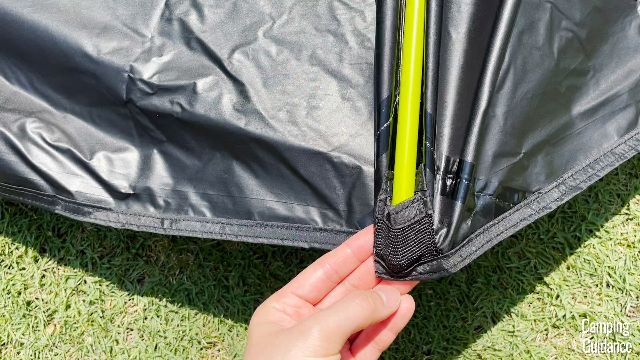 To secure the rainfly pole of the Coleman Sundome Dark Room Tent, you'd need to insert them into these small pockets or sleeves in the rainfly.