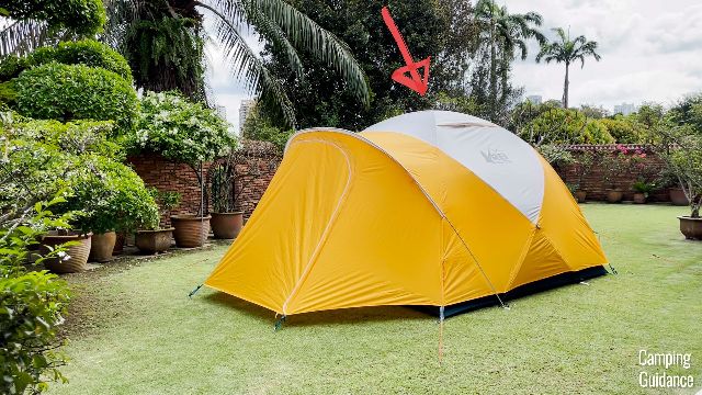 The REI Base Camp 6 in my yard. The red arrow is pointing to where the peak height is.