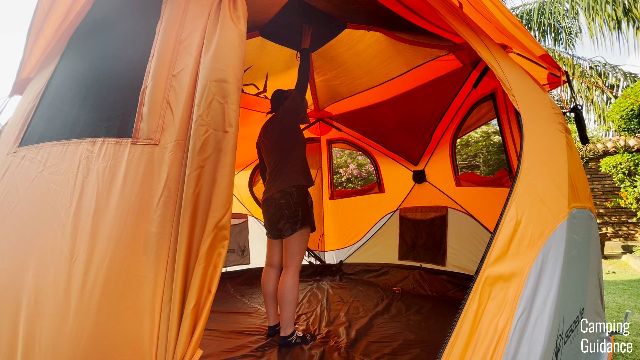 The author standing under the peak height of the Gazelle T4 Hub Tent