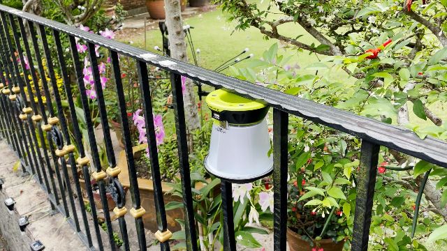The Goal Zero Lighthouse Core lantern hanging from a magnetic railing.