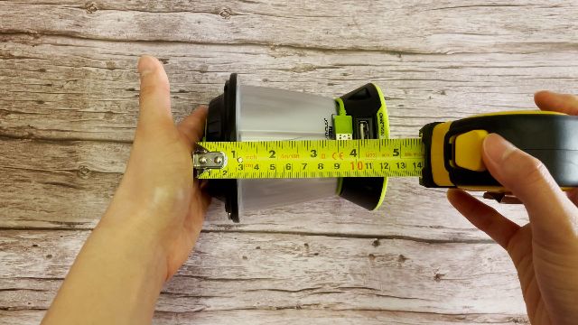 The author measuring the packed size of the Goal Zero Lighthouse Core lantern