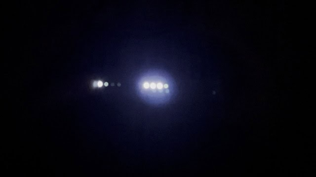 The battery indicator lights of the Claymore Portable Fan V600+ in the dark.
