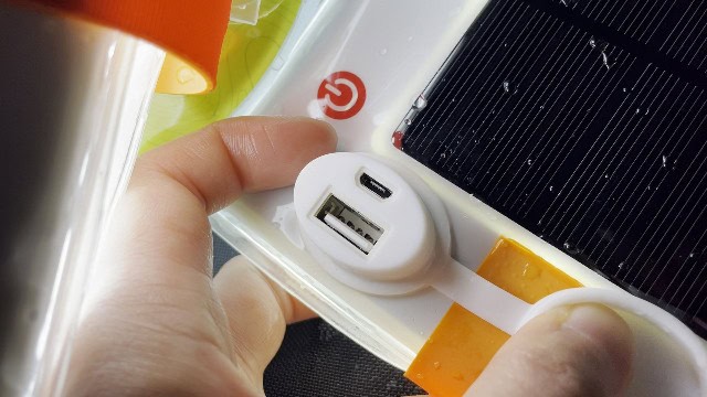 Water droplets in the port cap of the LuminAID PackLite Max.