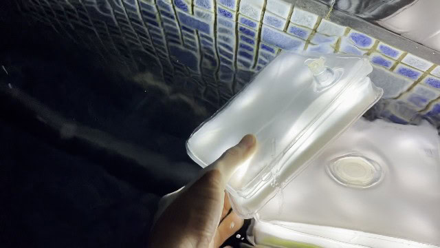 The LuminAID PackLite Max submerged in water.