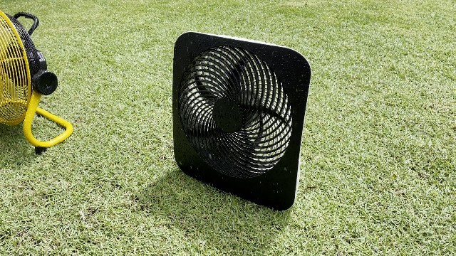 The author heavy rain testing the O2Cool Treva Fan.