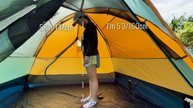 The author standing under the peak height of the Kelty Wireless 4.