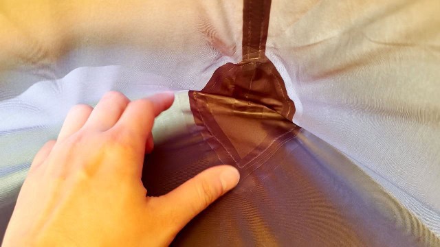 Seam taping in the REI Trail Hut 2.
